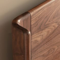 a close up view of a wooden headboard