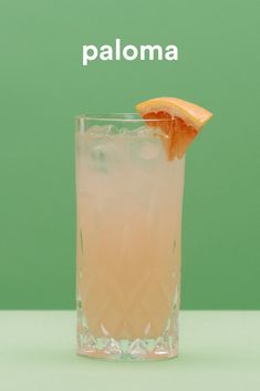 a tall glass with an orange slice on the rim and text that reads paloma