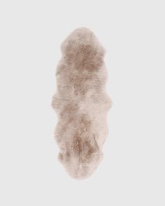 an animal fur rug on a white background