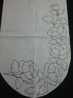 a piece of paper with flowers drawn on it and some black lines in the middle