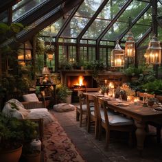 a dining room with an open fireplace and lots of plants on the table in front of it