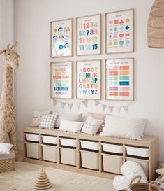 a child's room with posters on the wall and toys in storage bins