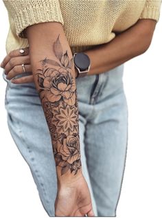 a woman with a flower tattoo on her arm