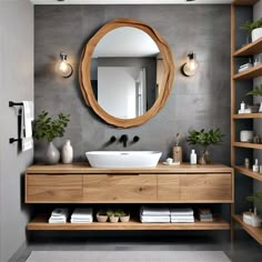 a bathroom with a sink, mirror and shelving unit in the middle of it