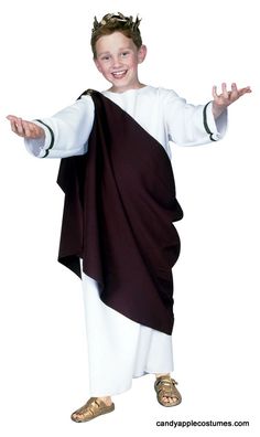 a young boy dressed in a costume with his arms outstretched and hands out to the side