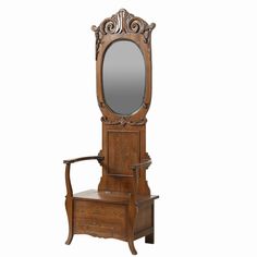 an antique wooden chair with a mirror on it