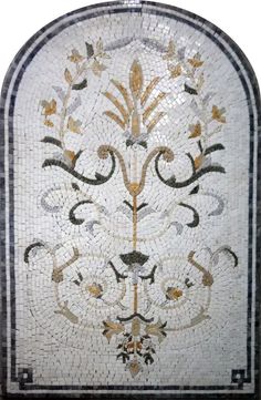 an ornate white and black tile with gold accents