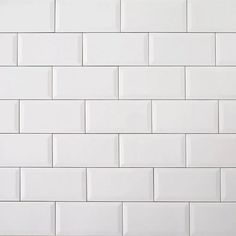 a white tiled wall with no one in it