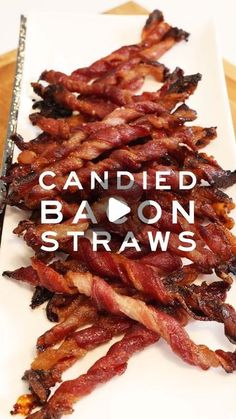 bacon on a white plate with the words candied bacon straws