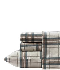 the plaid sheets are folded on top of each other