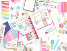 the contents of a planner spread out on a white surface with lots of papers and stickers