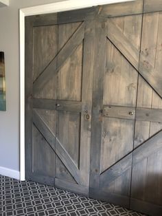 an open barn door in the corner of a room