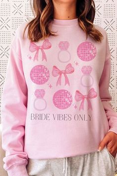 BRIDE VIBES ONLY Graphic Sweatshirt- Premium 8 oz., 50/50 cotton/ polyester- Air jet yarn for softer feel and reduced pilling- Classic Fit- Unisex Sizing Style: CASUAL Print / Pattern: BRIDE VIBES ONLY Silhouette: SWEATSHIRT Fit: UNISEX Neck Line: CREWNECK Sleeve: LONG SLEEVE Fabric Contents: 50% COTTON/ 50% POLYESTER Stretch fabric Non-sheer fabric Care Instructions: MACHINE WASH COLDLINE DRYSize Measurement (inch): S: 20.0 (Bust), null (Waist), null (Hips), 27.0 (Length) M: 22.0 (Bust), null ( Bride Vibes, Texas Teacher, Flat Mules, Pink Sand, Sheer Fabric, Tee Dress, Knit Set, Sweater Blouse, Jean Leggings