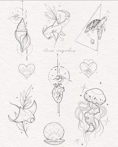 some drawings on paper with hearts and other things in the shape of fish, turtle, heart