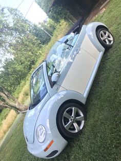 a car that is sitting in the grass