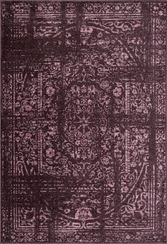 a purple rug with an intricate design on the front and back side, in shades of pink