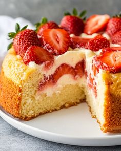 a close up of a cake with strawberries on it and one slice cut out