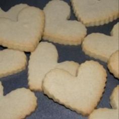 some heart shaped cookies are on a table