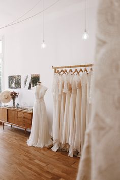 the bridal gowns are on display in the room, and there is no image here to provide a caption for