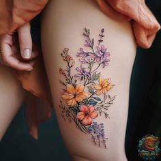 a woman's thigh with flowers on it