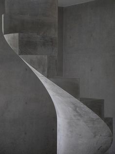 an abstract photo of concrete stairs in a room with no one on the ground or people walking up them