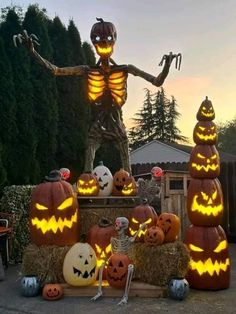 pumpkins and jack - o'- lanterns are lit up for halloween