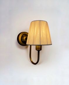 a wall light with a lamp shade on it