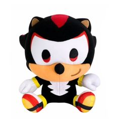 an image of a stuffed animal toy that is black and white with red accents on it