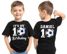 two young boys wearing matching soccer shirts with the number one on it's chest