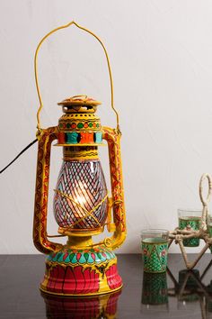 a colorful lantern sitting on top of a table