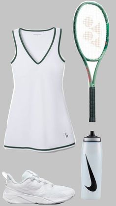 a women's tennis outfit with a racket and bottle