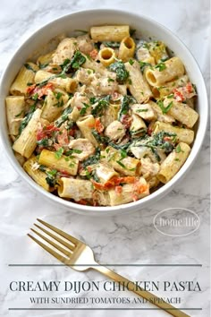 a white bowl filled with pasta and chicken