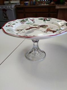 a glass cake plate sitting on top of a counter