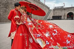 a man and woman dressed in traditional chinese garb