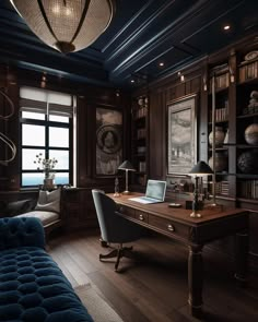 a desk with a laptop on top of it in a room filled with bookshelves