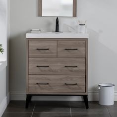 Update your bathroom with the Piper 31.1-in forest elm woodgrain vanity with white single-sink top. This freestanding bathroom vanity features a mid-century modern design with a soft brown woodgrain finish and matte black drawer pulls for a modern look. Designed to maximize storage, this pre-assembled bathroom vanity features 3 soft-close full extension drawers to keep all your bathroom essentials organized and within easy reach. With its 31.1-in W x 18.75-in D x 36.66-in H size and integrated storage, this vanity adds style and functionality to small to medium-sized bathrooms. Diamond NOW Piper 31-in Forest Elm Brown Woodgrain Single Sink Bathroom Vanity with White Cultured Marble Top | C30W30129 Black Drawer Handles, Integrated Storage, Black Drawer, Black Drawer Pulls, Cultured Marble Vanity Top, White Faucet, Black Drawers, Maximize Storage, Single Sink Bathroom