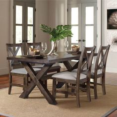 This 5-piece dining set brings a casual and warm feel to your eat-in kitchen or dining room. It includes four classic side chairs and a rectangular table with a timber beam trestle base and a plank top. Each piece is crafted from kiln-dried solid and engineered wood with a mocha brown finish. The chairs show off X-cross backs and oatmeal-toned faux leather seats for a modern farmhouse look we love. Our favorite part? An 18" leaf comes with this set to extend the table top to 80" wide, accommodat Dc House, Silver Furniture, Wood Dining Room, 7 Piece Dining Set, Solid Wood Dining Chairs, 5 Piece Dining Set, Coaster Furniture, Dining Room Set