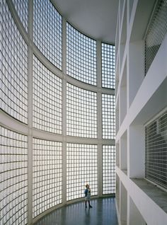 a person is standing in the middle of a room that has many squares on it