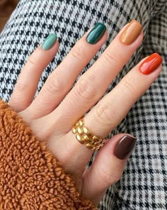 Looking for the perfect nail inspiration this fall? We've got you covered with the best fall nail designs to create a chic manicure! Fall Skittle Nails 2023, Fall Colorful Nails, Multicolored Nails Winter, Multi Colored Fall Nails, Skittle Nails Color Combos, Multi Colored Nails Winter, Short Multicolor Nails, Nails Color Combinations, Multi Colored Nails Fall