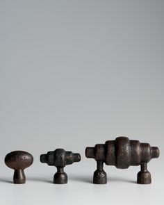 three wooden knobs sitting next to each other