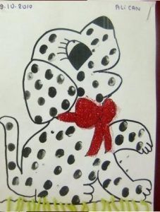 a drawing of a white and black spotted dog with a red bow