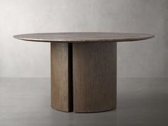 a round dining table with two circular wooden bases