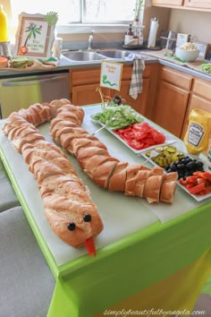 an assortment of food is displayed on a table