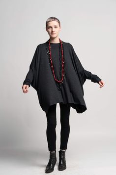 This comfortable oversized round neck Gray tunic top is such a great addition to your wardrobe. It can be worn in both summer and winter.  In summer pair it with leggings or shorts, In winter pair it with funky warm leggings or jeans. Color - Grey Material: 80% viscose 20% polyester Sizes: One Size Bust: 230cm/ 90" Length: 71cm /  28" Care instructions: - Turn garment inside out before washing - Hand wash in cold water separately from other garments - Do not bleach - Do not harshly scrub a specific spot - Do not tumble dry - Hang to dry in the shade, turned inside out View my store for more beautiful items: https://www.etsy.com/shop/UrbanicTribe Like my FB page to be the first to know about new designs, promotions and special offers: https://www.facebook.com/pages/Urbanic-Tribe/71035568572 Tunic And Leggings Outfit, Leggings Outfit Plus Size, Shorts In Winter, Tunic And Leggings, Tunics With Leggings, Women Tunic, Urban Apparel, Maternity Tunic, Flowy Tunic