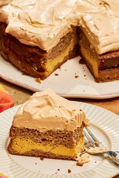 a piece of cake on a plate with a fork next to it and another slice missing