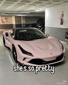 a pink sports car parked in a parking garage with the words she's so pretty