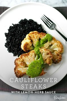 a white plate topped with cauliflower and black rice