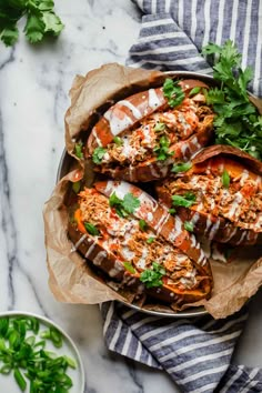 baked sweet potatoes topped with shredded parmesan cheese and garnished with cilantro