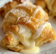 some food is on a white plate and has been drizzled with icing