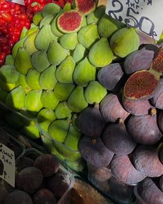 an assortment of fruits and vegetables on display at a market